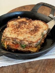 kimchi grilled cheese in a small skillet