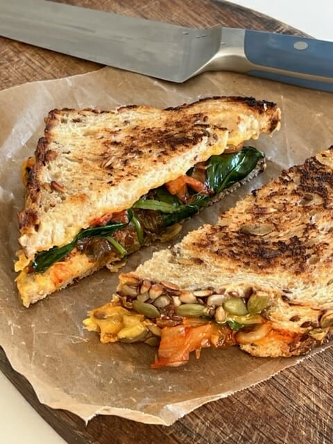kimchi grilled cheese sandwich on wax paper