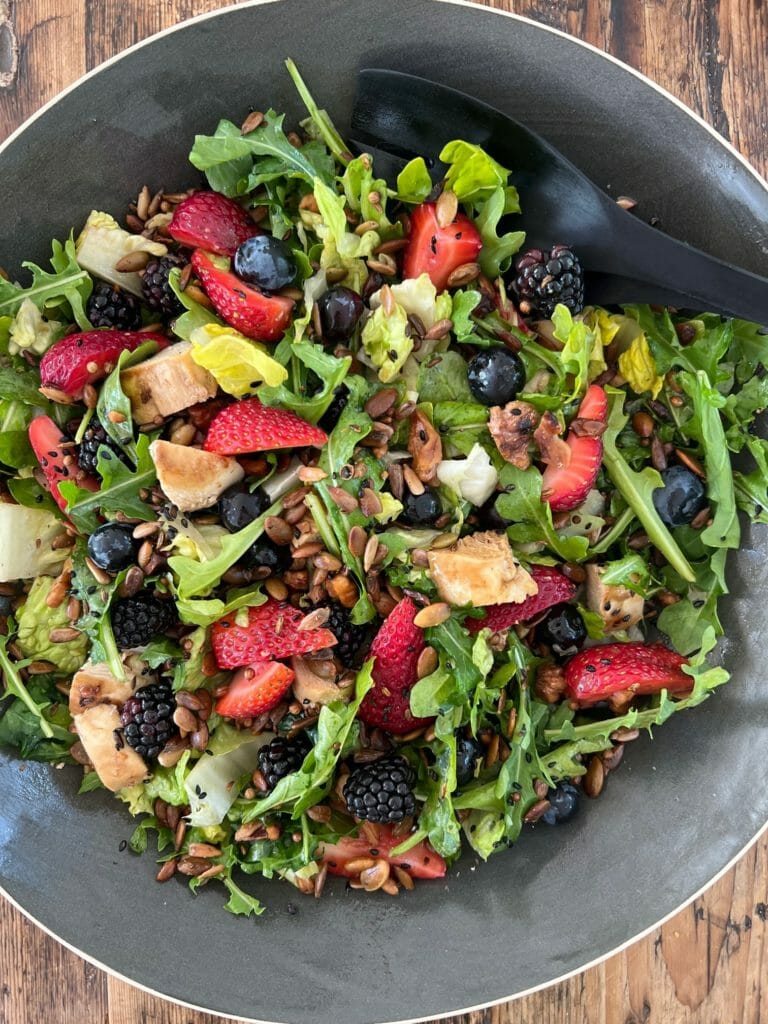 salad with berries and dark leafy greens