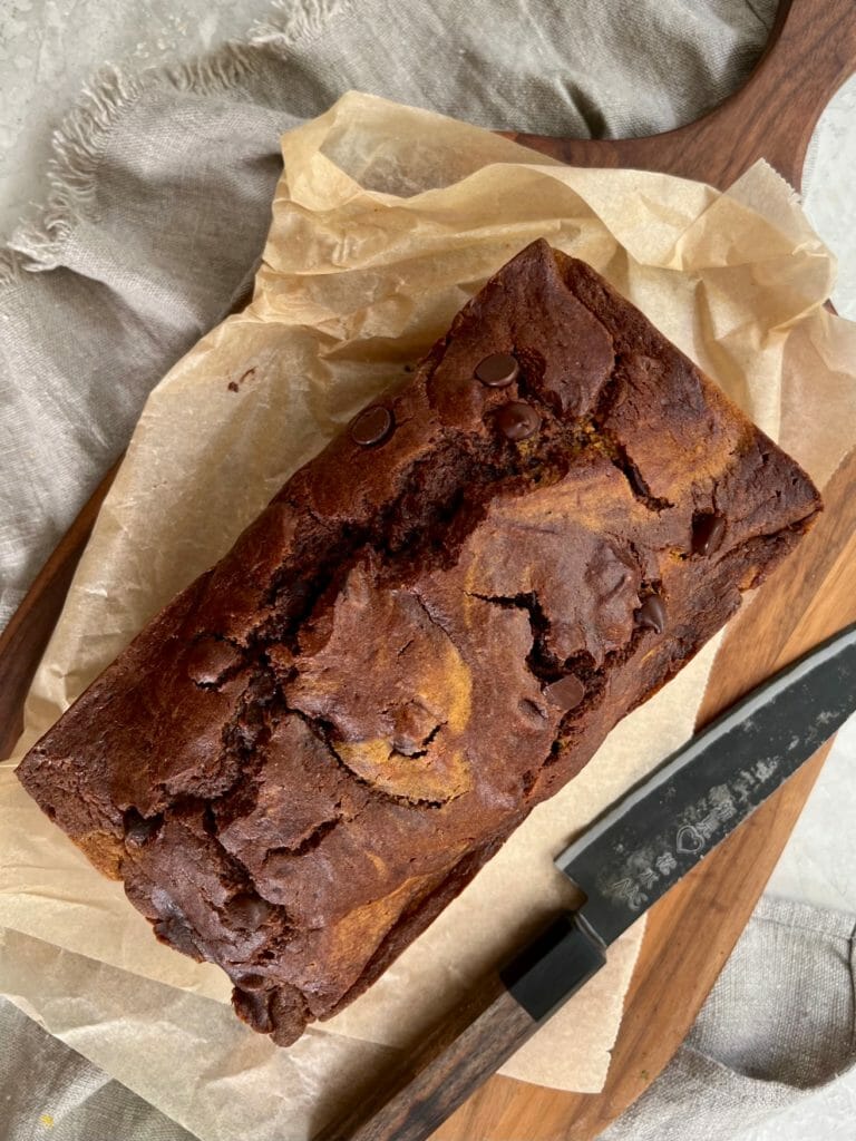 Overhead shot of chocolate pumpkin cake on parchment