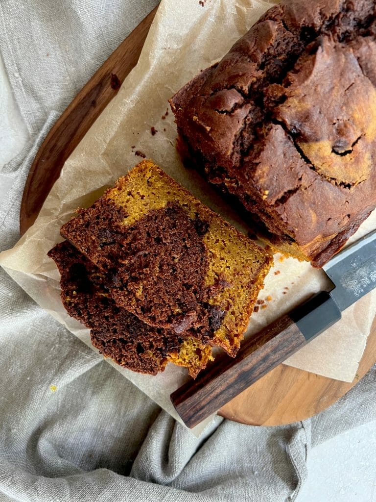 Slices of chocolate pumpkin cake with knife