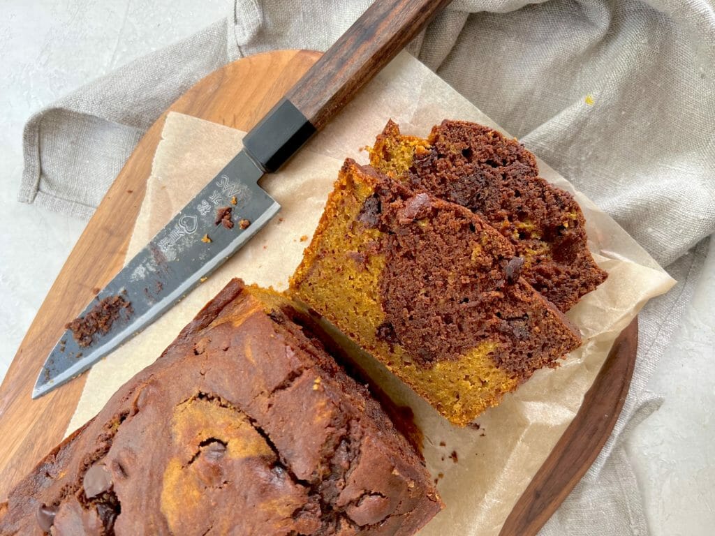 Slices of marbled chocolate pumpkin cake with a knife