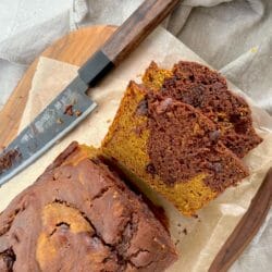 Slices of marbled chocolate pumpkin cake with a knife