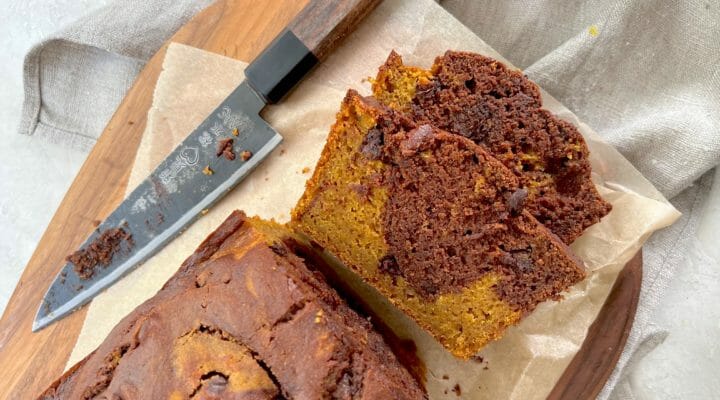 Slices of marbled chocolate pumpkin cake with a knife