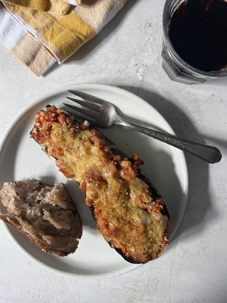 stuffed eggplant parm with crusty bread and wine